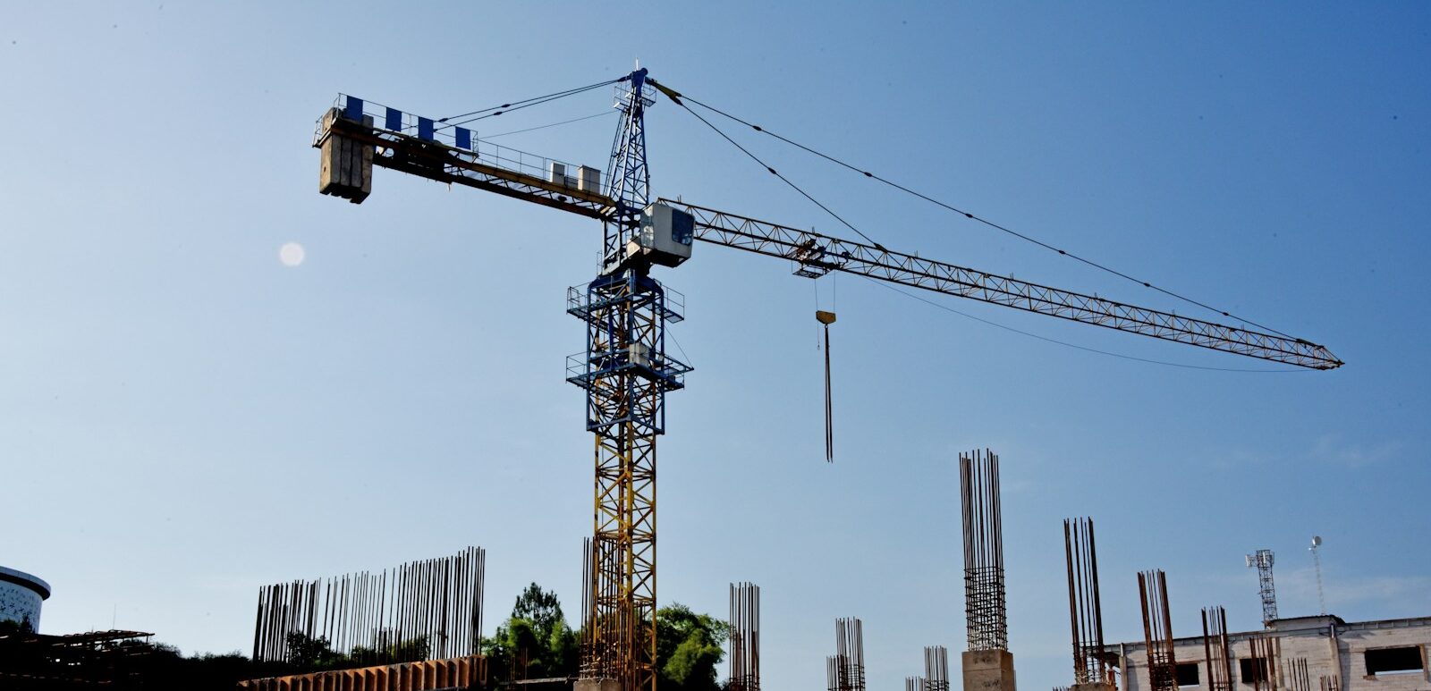 a construction site with a crane in the background